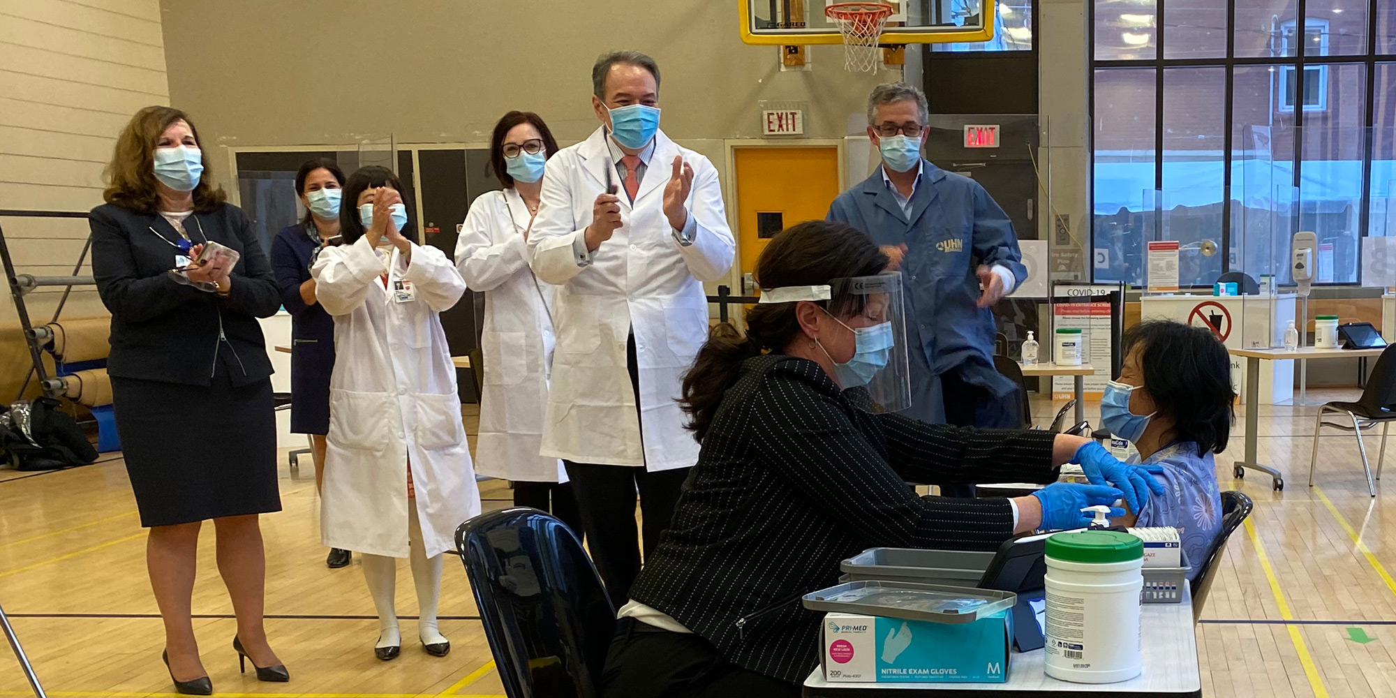 Photo essay: 2020 in review (image showing Anita Quidangen, a personal support worker - first member of TeamUHN to be vaccinated)