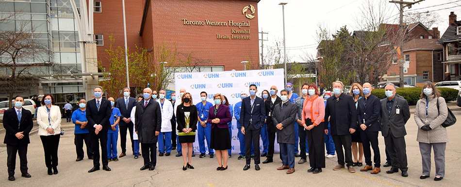 Christine Elliott and Robin Martin surrounded by members of TeamUHN