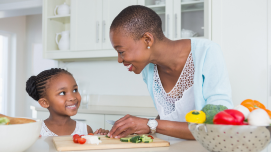 A mother and daughter having fun in the kitchen