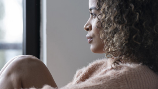 A woman looking out a window