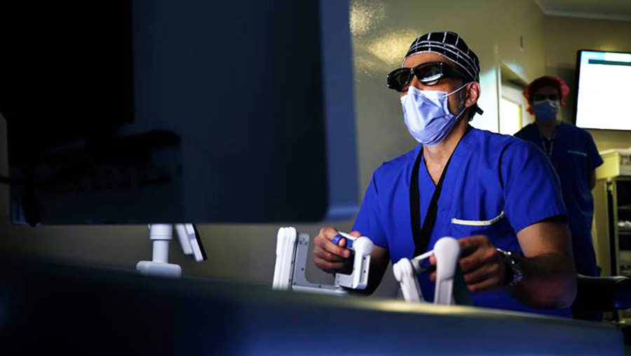 Dr. Tony Finelli, pictured here at the controls of a robot during surgery, has been a passionate advocate for the advancement of robotic technology at UHN, paving the way for a new era of innovation and optimizing care for our patients. (Photo: UHN)