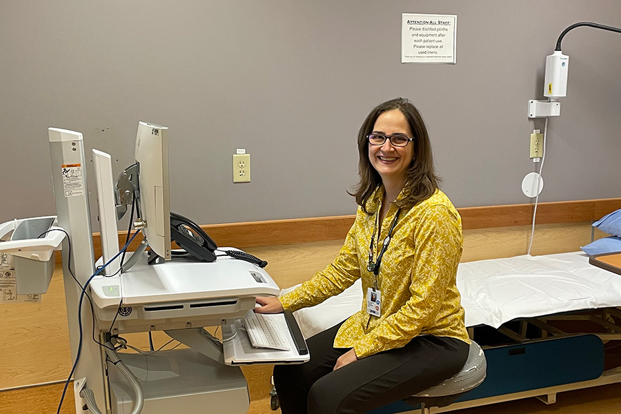 Dr. Andrea Furlan, a leader in chronic pain treatment and a physician at Toronto Rehab, at the computer where she hosts virtual sessions of the ECHO Ontario Chronic Pain and Opioid Stewardship program.