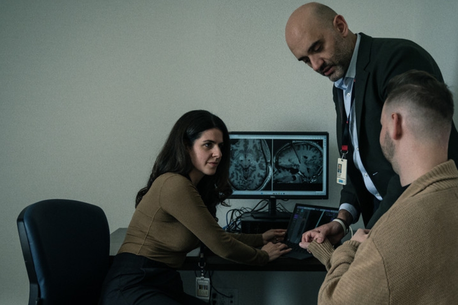 Neurologist Dr. Fasano and nurse practitioner Talia performing deep brain stimulation on a patient.
