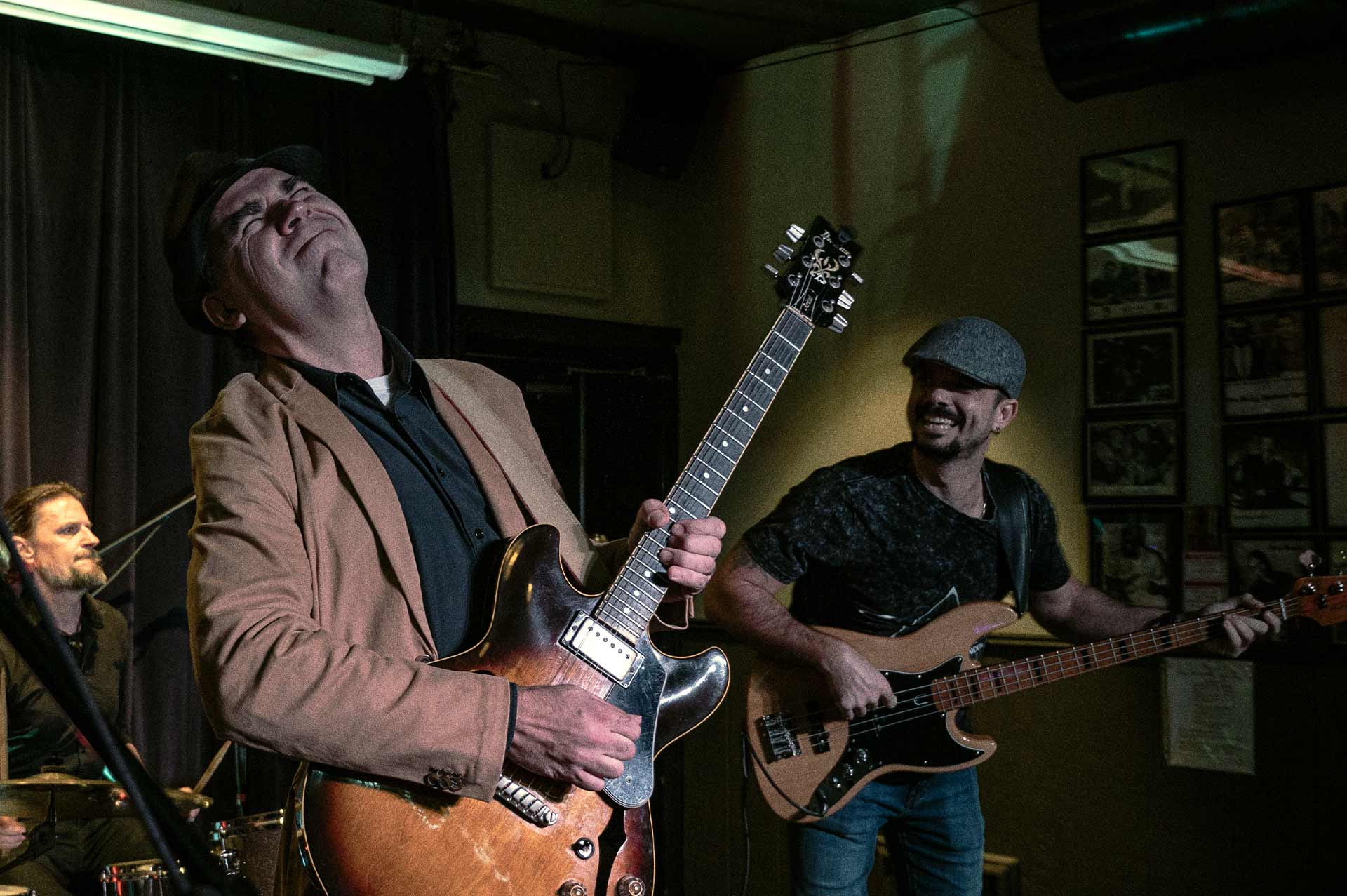 A grateful patient plays guitar on stage with his band.