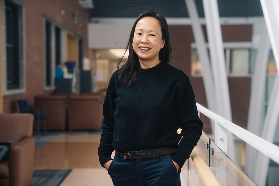 Dr. Esther Bui smiling while at Toronto Western Hospital.